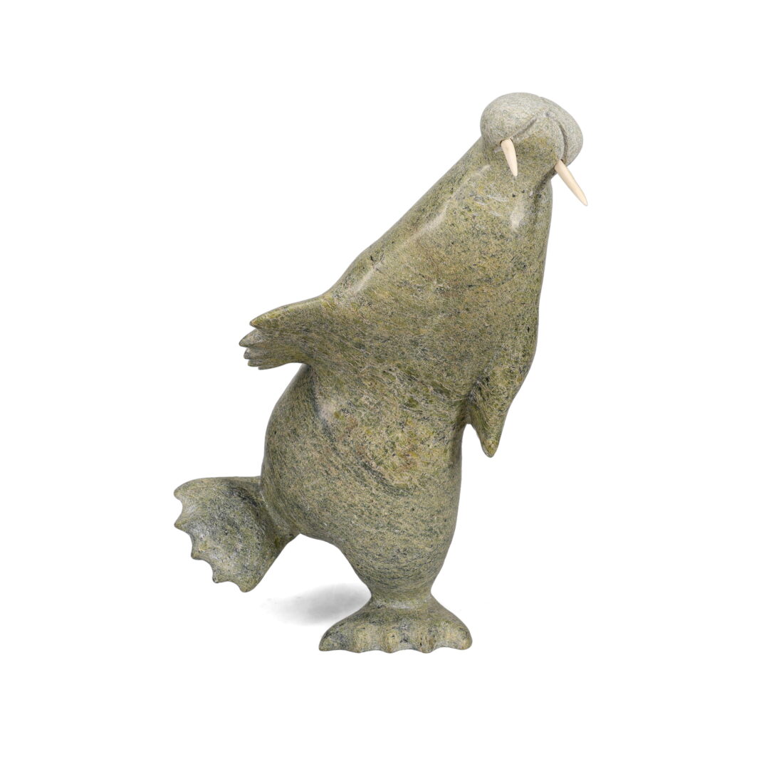 One original hand-carved sculpture by Inuit artist, Pudlalik Shaa. One dancing walrus carved out of serpentine.