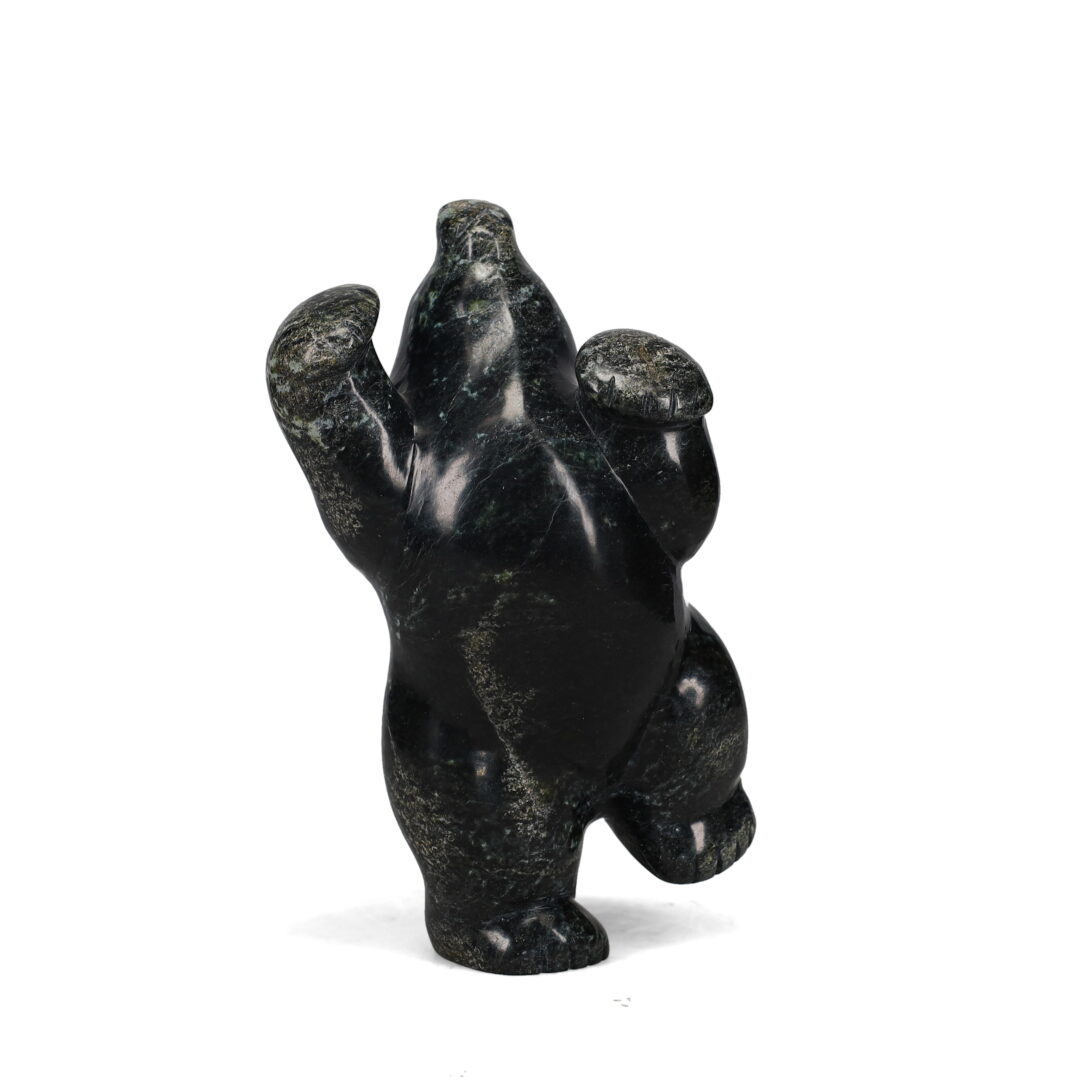 One original hand-carved sculpture by Inuit artist, Markoosie Papigatuk. One original sculpture hand-carved out of serpentine.