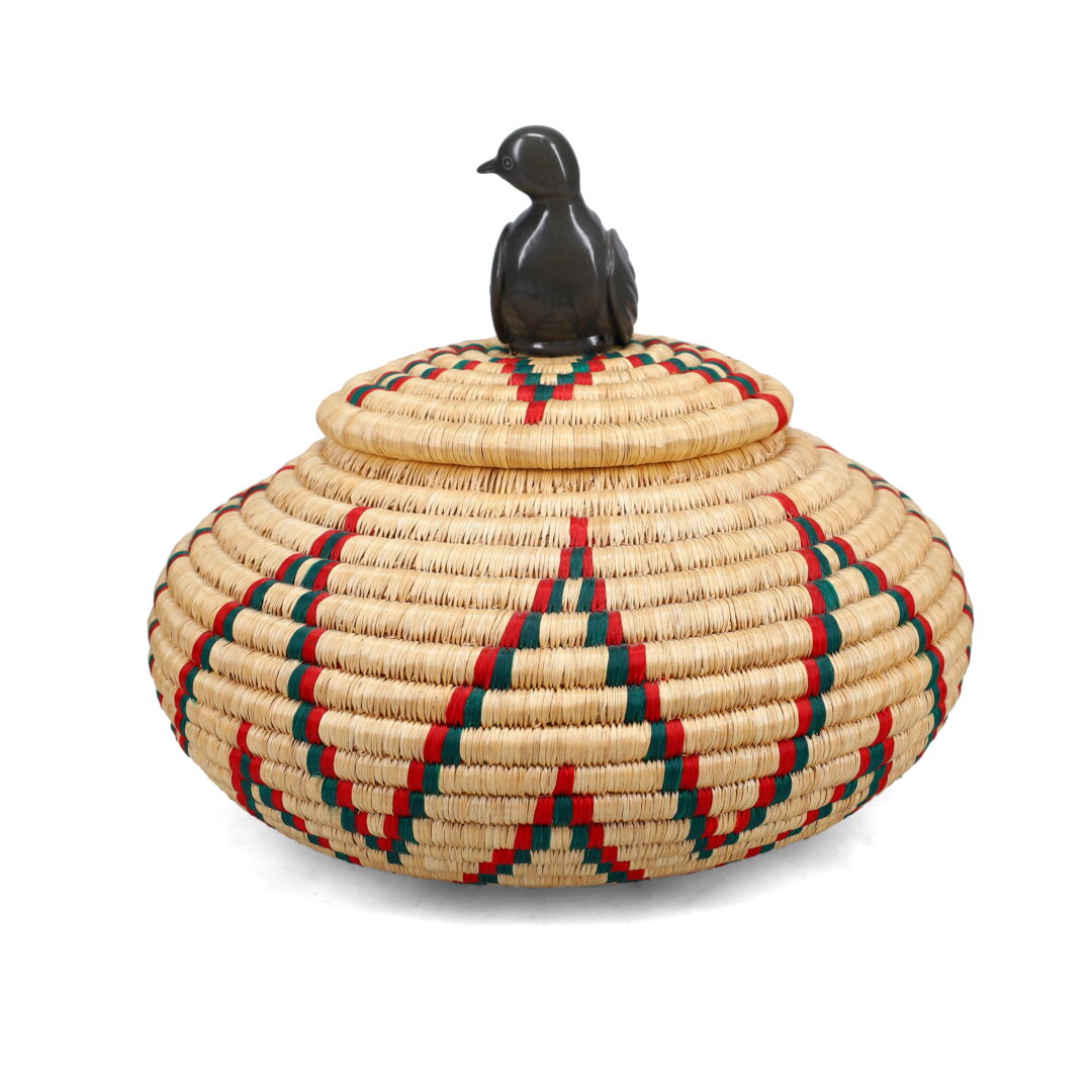 One original hand-carved sculpture by Inuit artist, Sarah Appagaq. One Inuit basket made of plant materials.
