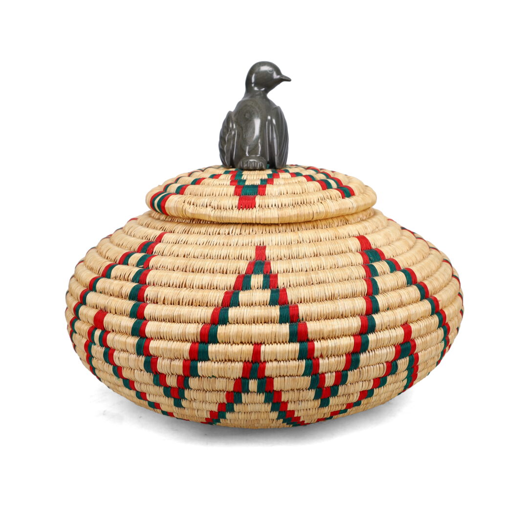 One original hand-carved sculpture by Inuit artist, Sarah Appagaq. One Inuit basket made of plant materials.
