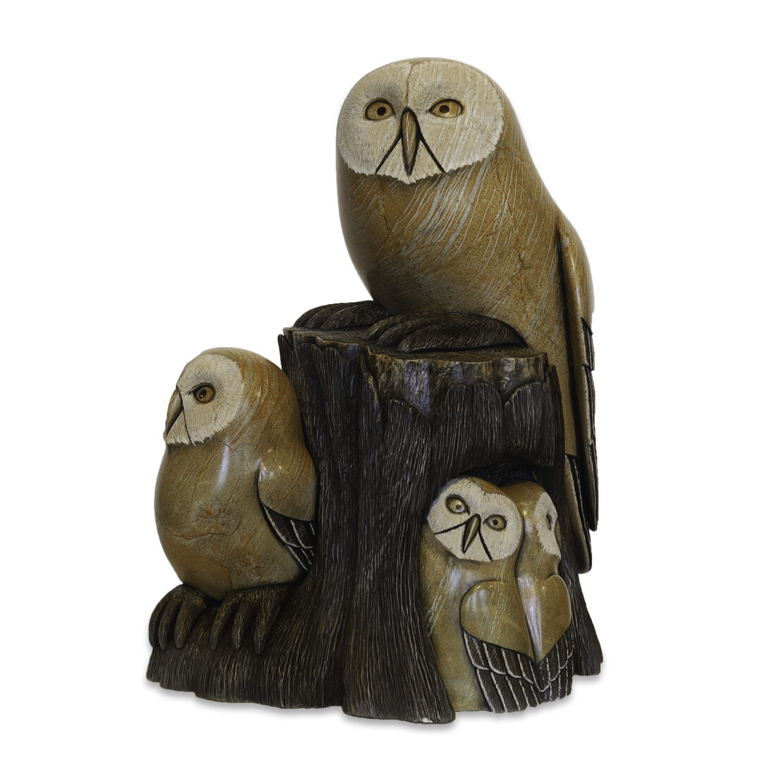 One original hand-carved sculpture by Iroquois artist, Cyril Henry. One owl family carved out of soapstone.