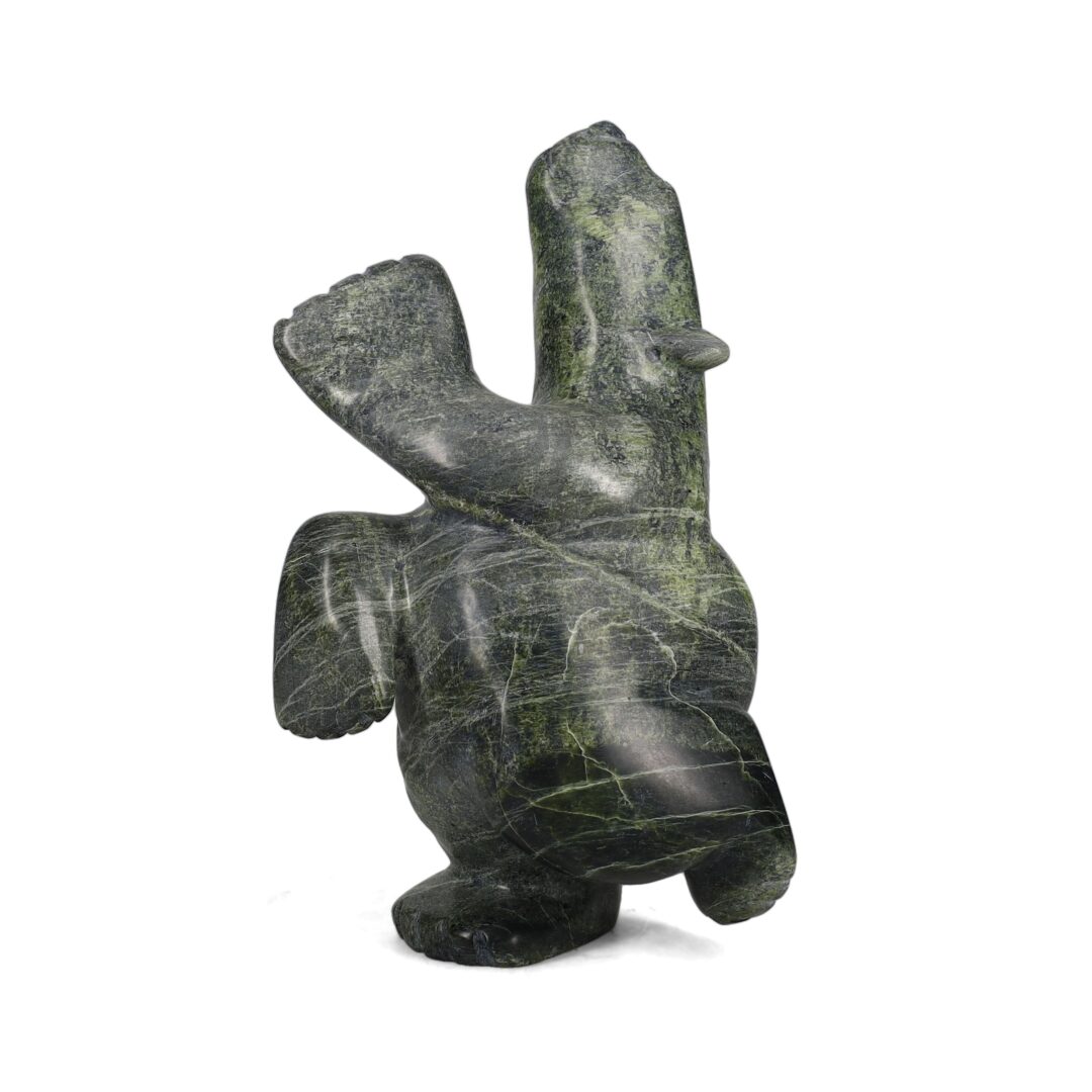 One original hand-carved sculpture by Inuit artist, Jimmy Tunnille. One dancing bear carved out of serpentine.