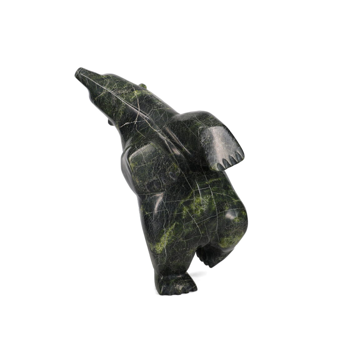 One original hand-carved sculpture by Inuit artist, Joanie Ragee. One dancing bear carved out of serpentine.