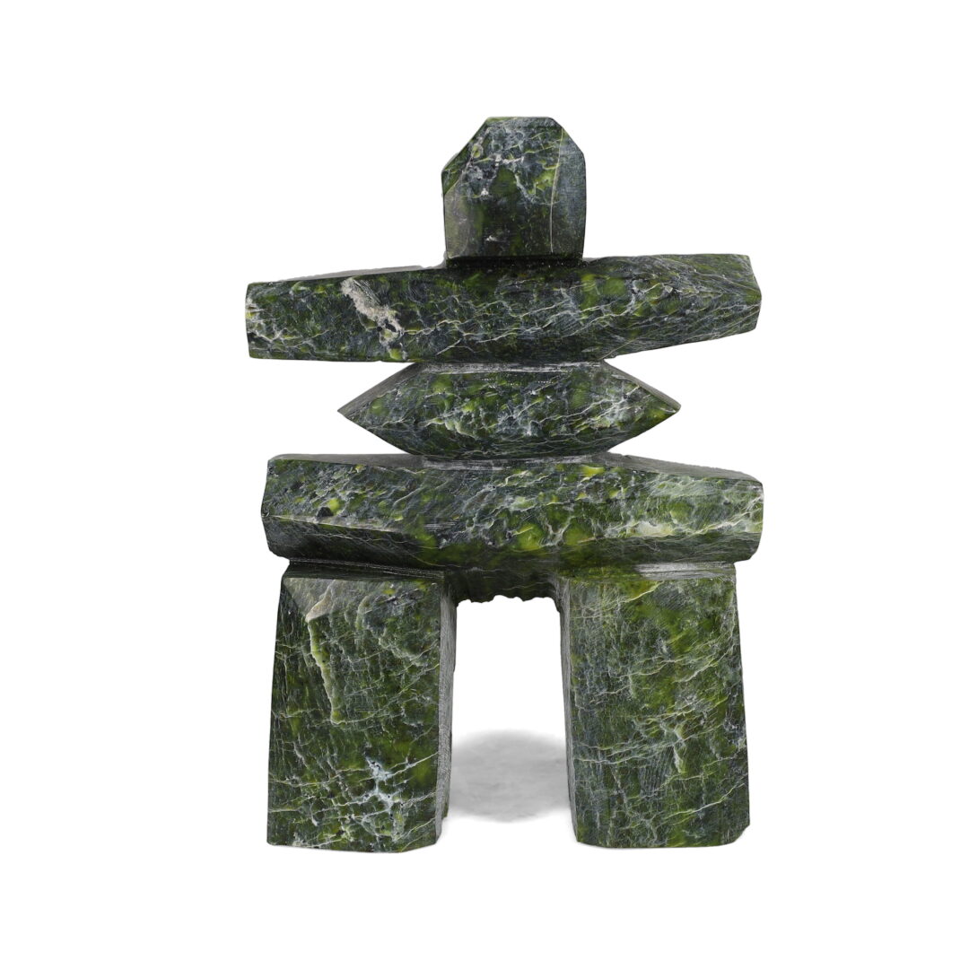 One original hand-carved sculpture by Inuit artist, Peter Aningmiuq. One inukshuk carved out of serpentine.