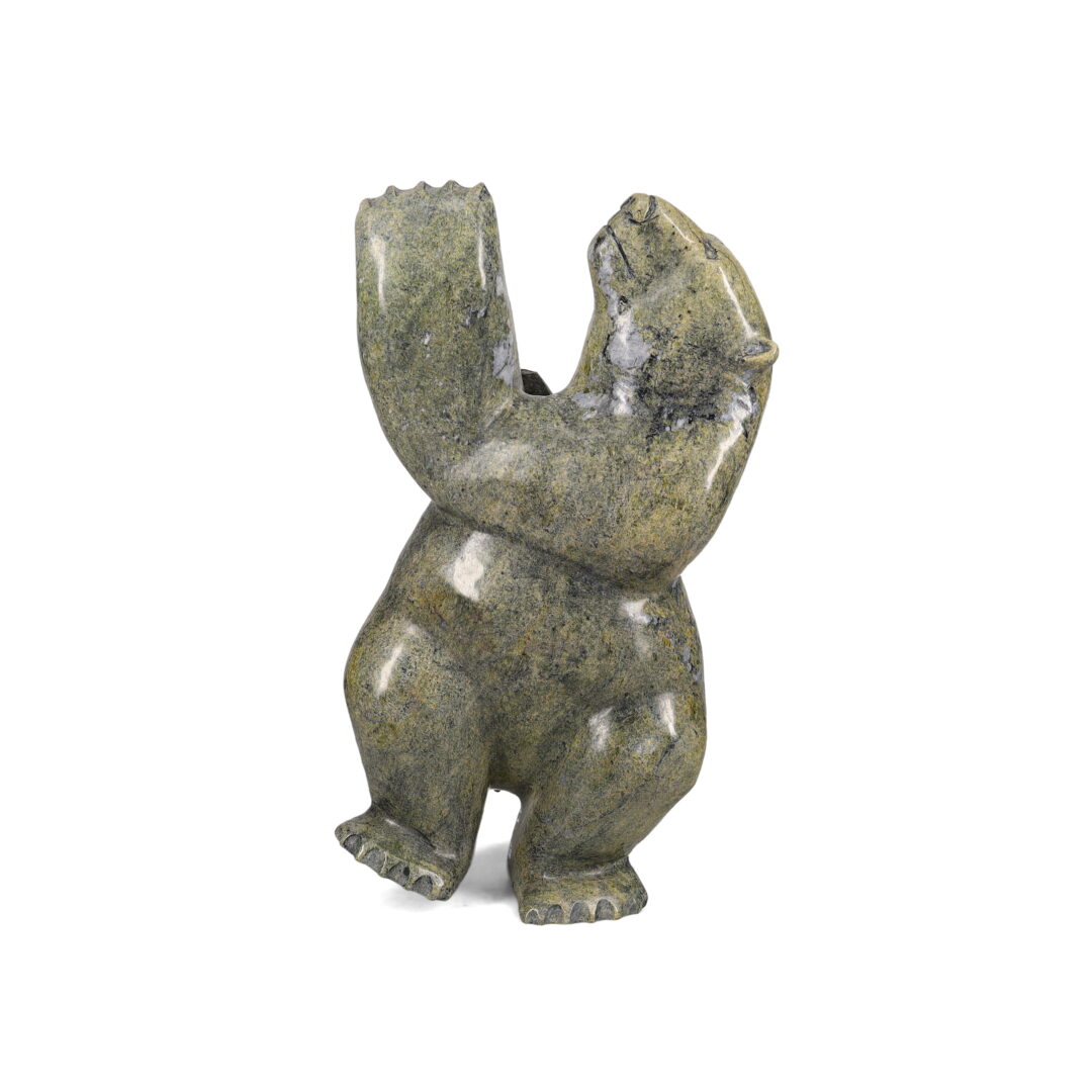 One original hand-carved sculpture by Inuit artist, Isaaci Petaulassie. One dancing bear carved out of serpentine.