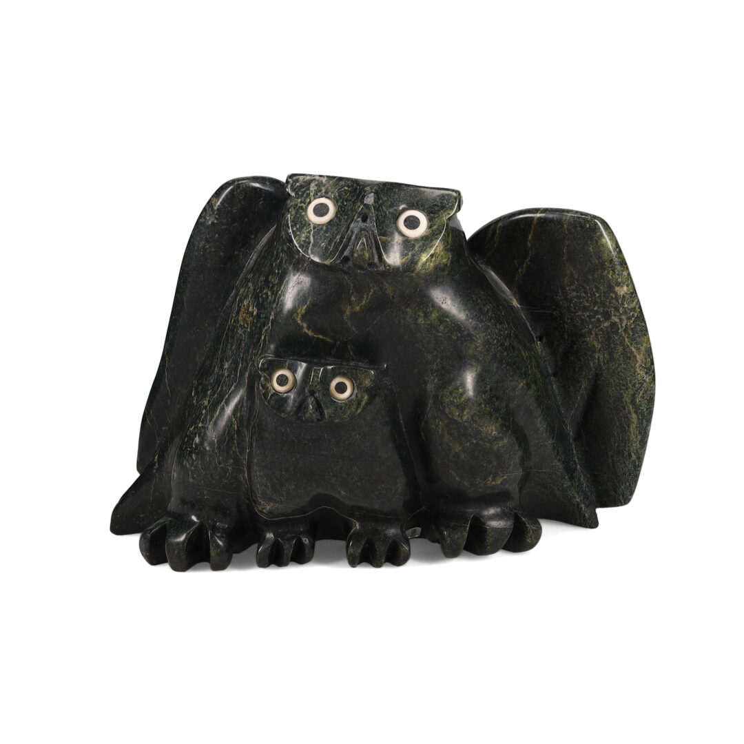 One original hand-carved sculpture by Inuit artist, Joanassie Manning . One owl and chick carved out of serpentine.
