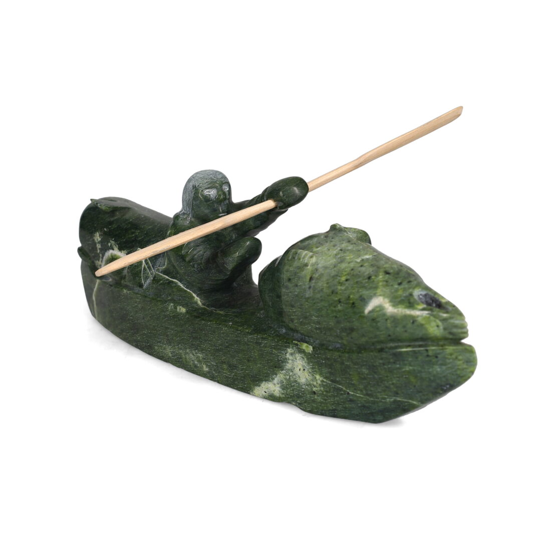 One original hand-carved sculpture by Inuit artist, Willie Kolola. One kayaker carved out of serpentine stone.