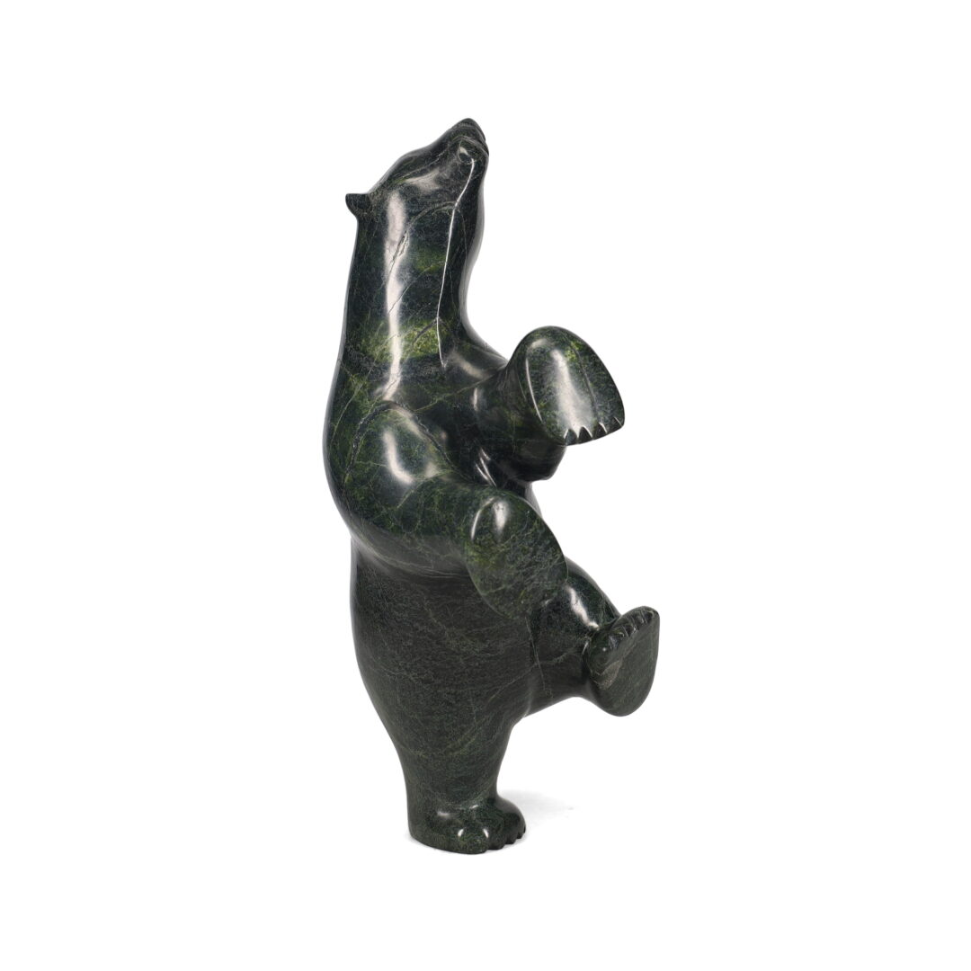 One original hand-carved sculpture by Inuit artist, Etidloie Adla. One dancing bear carved out of serpentine.