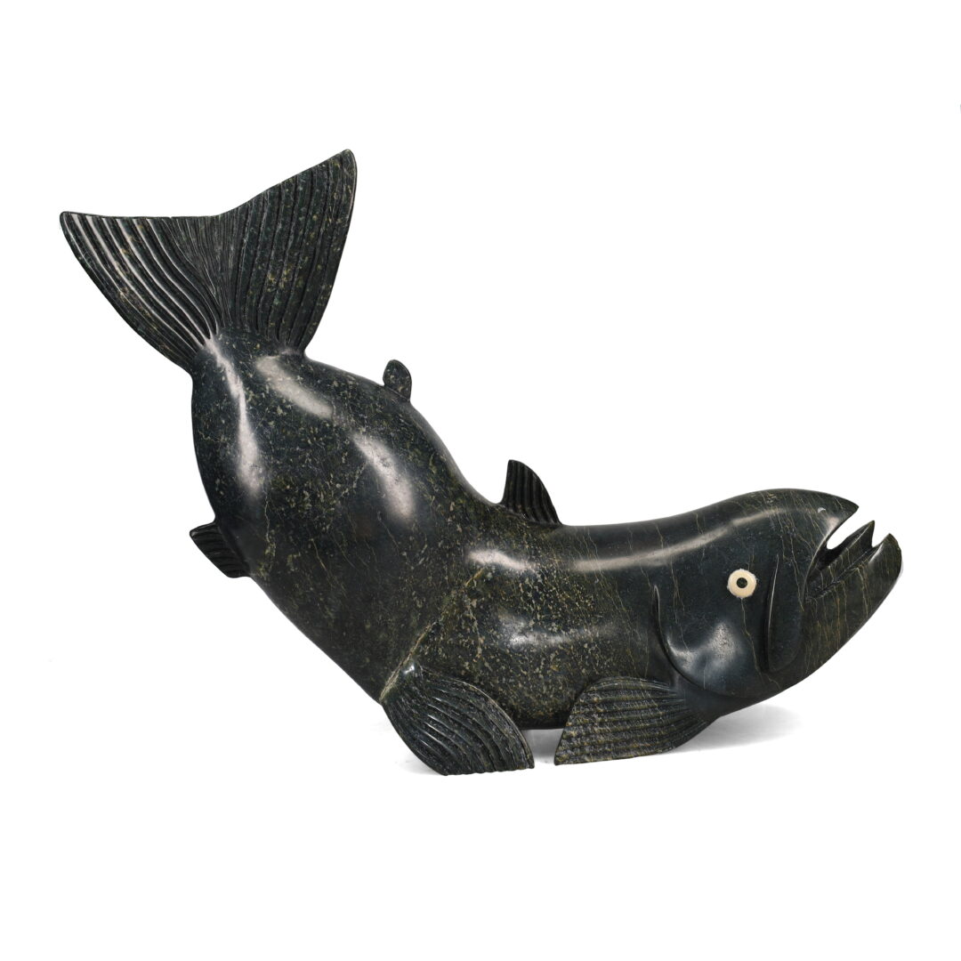 One original hand-carved sculpture by Inuit artist, Toonoo Sharky. One Arctic char carved out of serpentine.