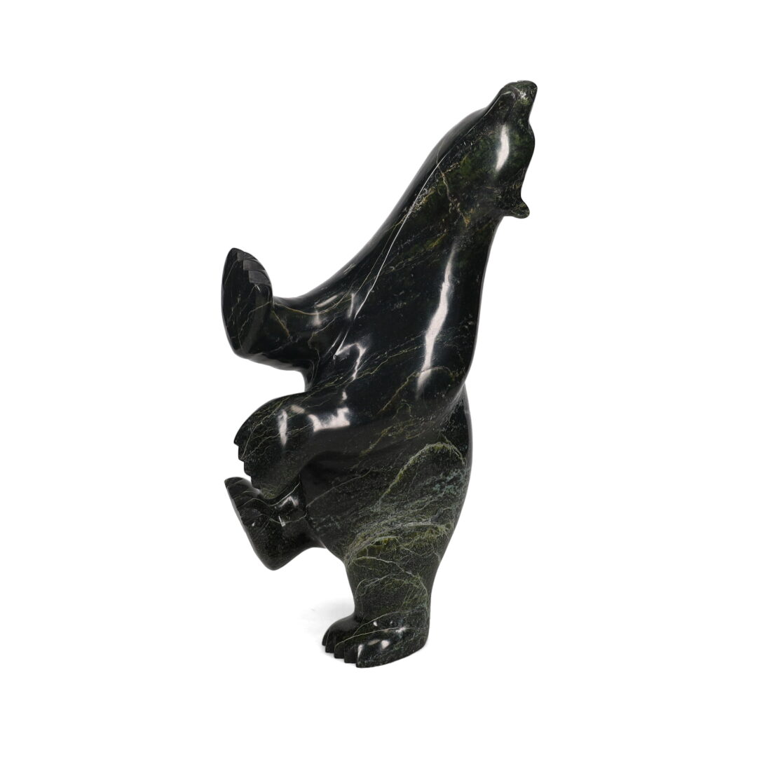 One original hand-carved sculpture by Inuit artist, Ashevak Adla. One dancing bear carved out of serpentine.