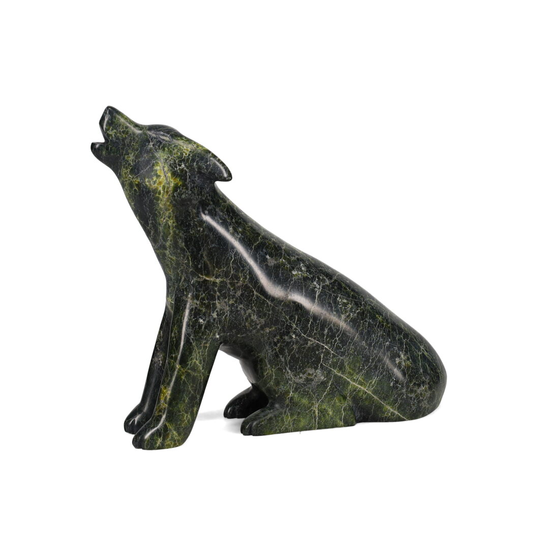 One original hand-carved sculpture by Inuit artist, Matt Flaherty. One wolf carved out of serpentine stone.