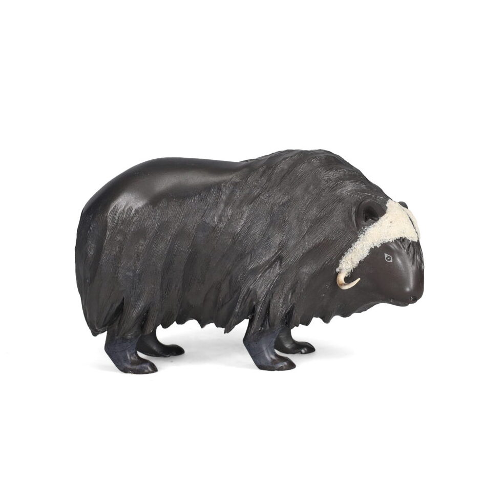 One original hand-carved sculpture by Inuit artist, Derrald Taylor . One muskox carved out of soapstone and antler.