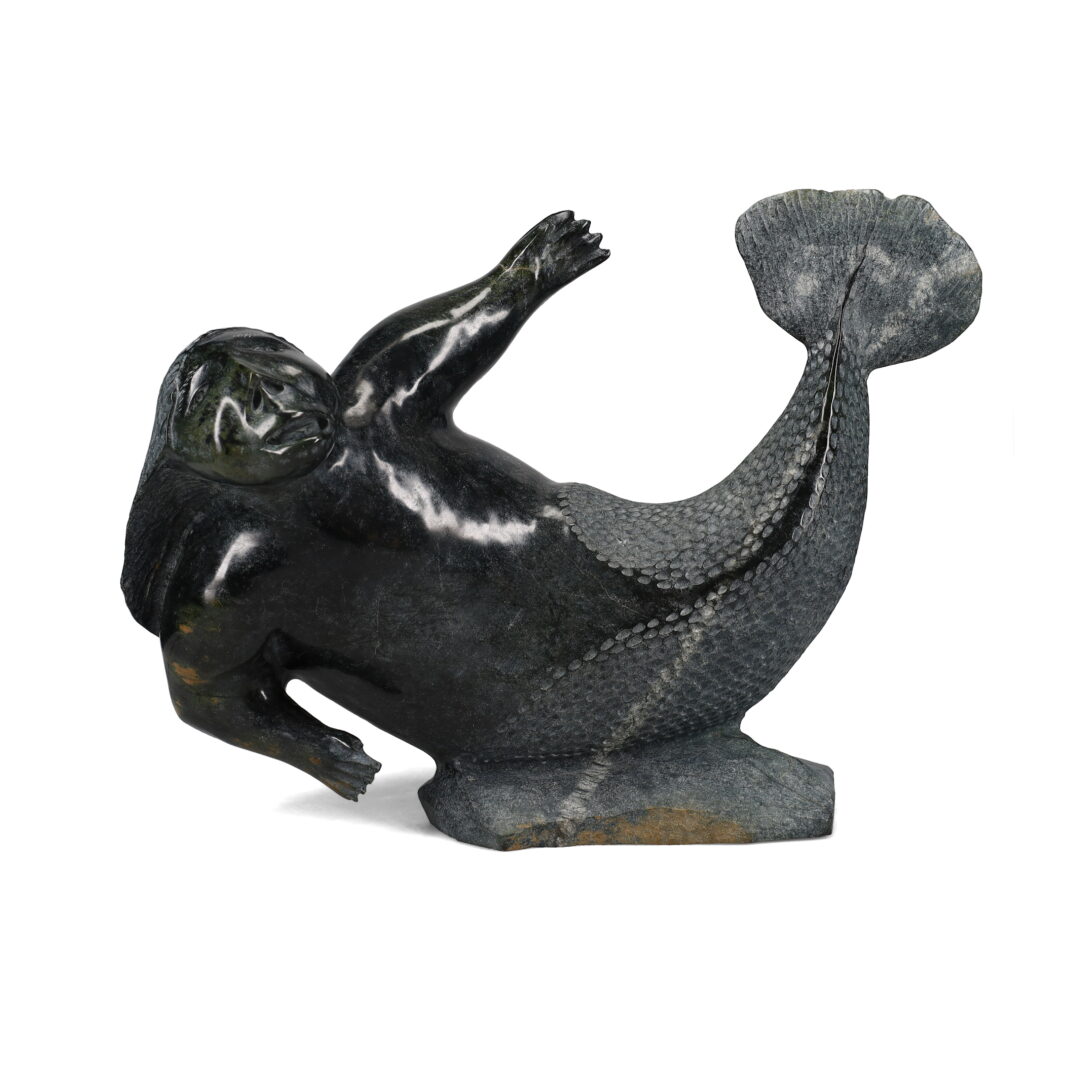 One original hand-carved sculpture by Inuit artist, Jaco Ishulutak. One Sedna carved out of serpentine stone.