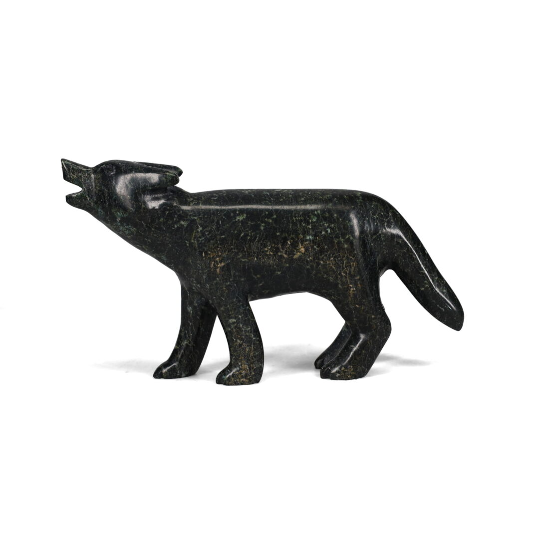 One original hand-carved sculpture by Inuit artist, Matt Flaherty. One wolf carved out of serpentine stone.