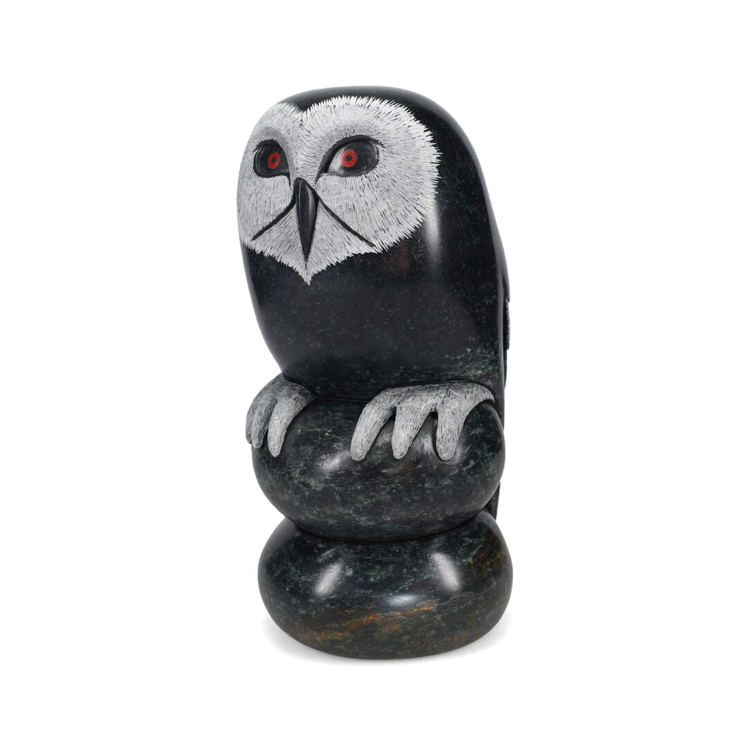 One original hand-carved sculpture by Iroquois artist, Cyril Henry. One owl carved out of black soapstone.