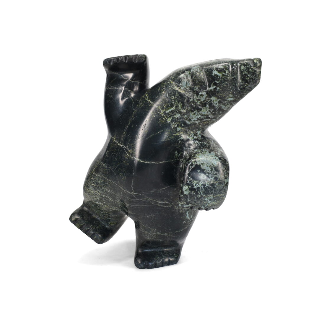 One original hand-carved sculpture by Inuit artist, Noah Parr. One 2-way dancing bear carved out of serpentine.