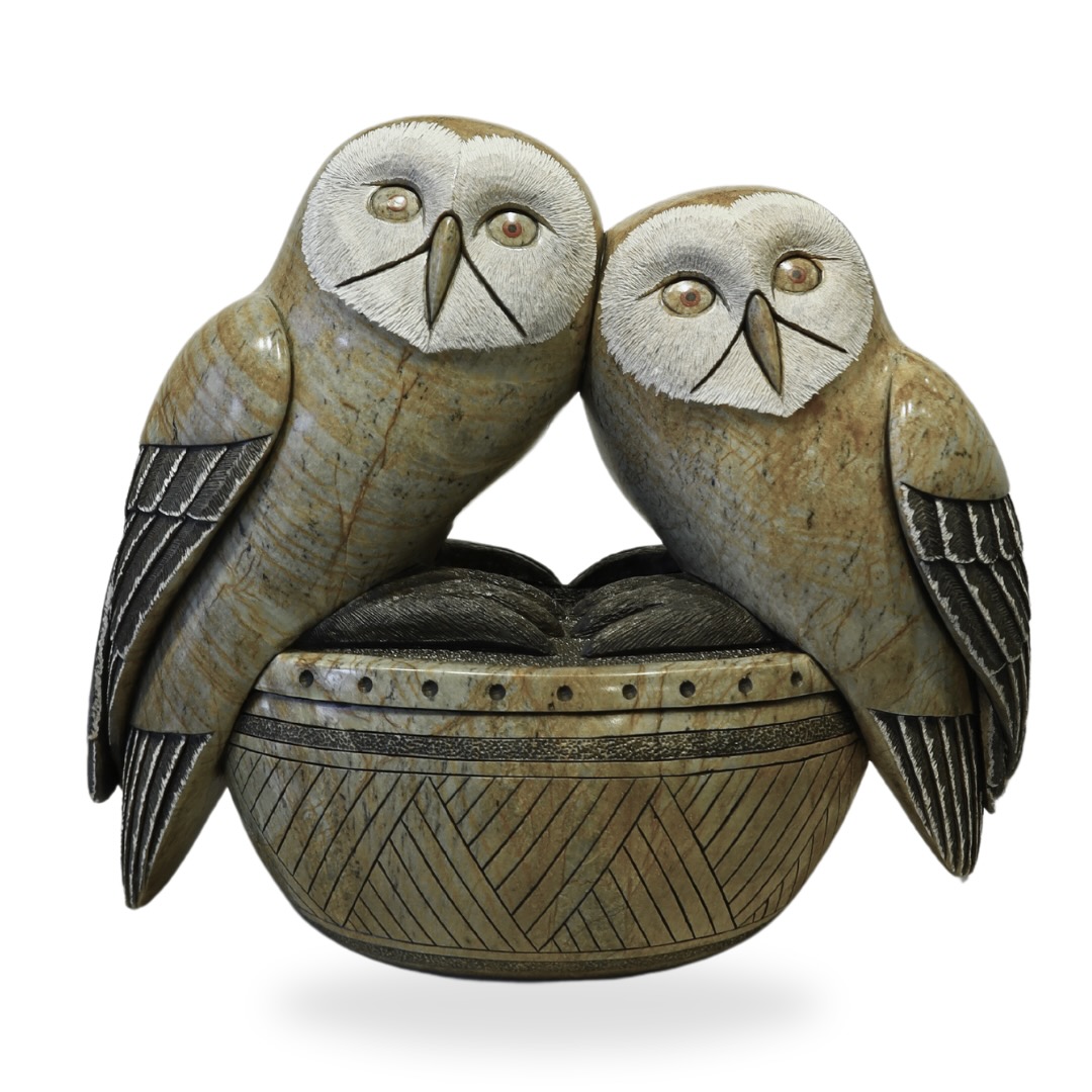 One original hand-carved sculpture by Iroquois artist, Cyril Henry. One owl sitting on a log carved out of soapstone.