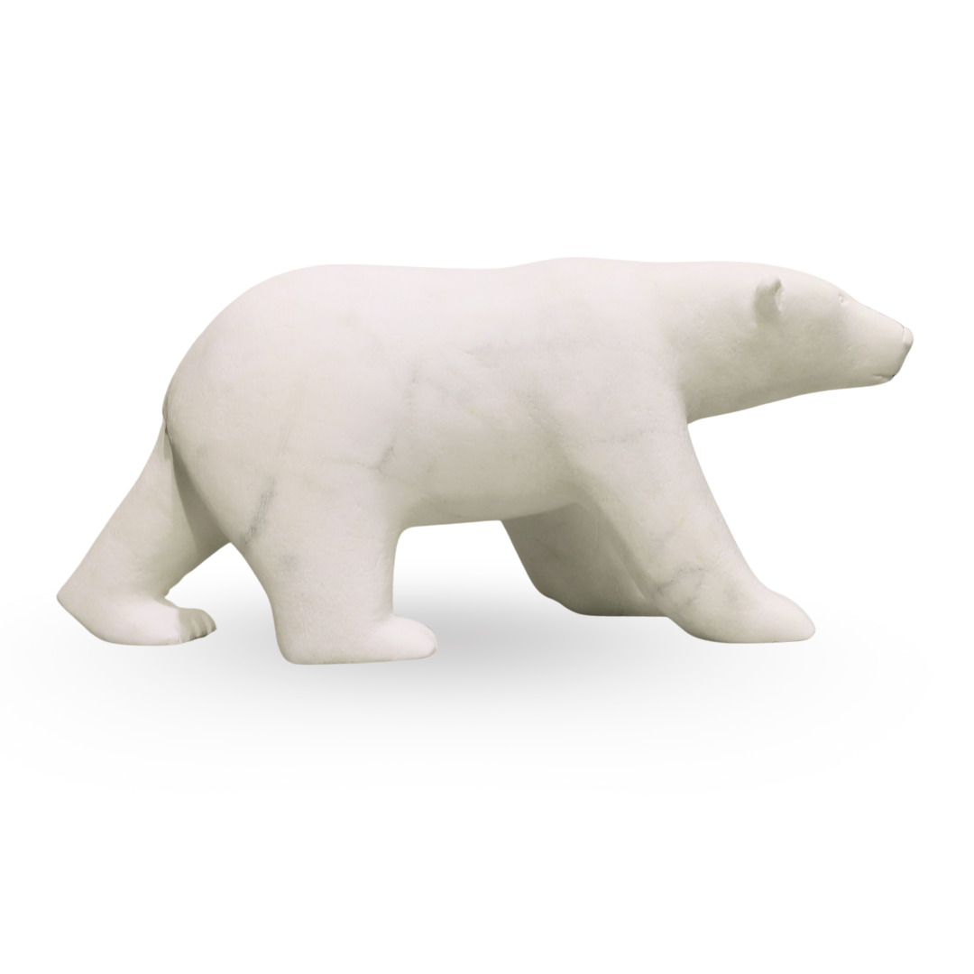 One original hand-carved sculpture by Inuit artist, Koomatuk Curley. One walking bear carved out of alabaster.