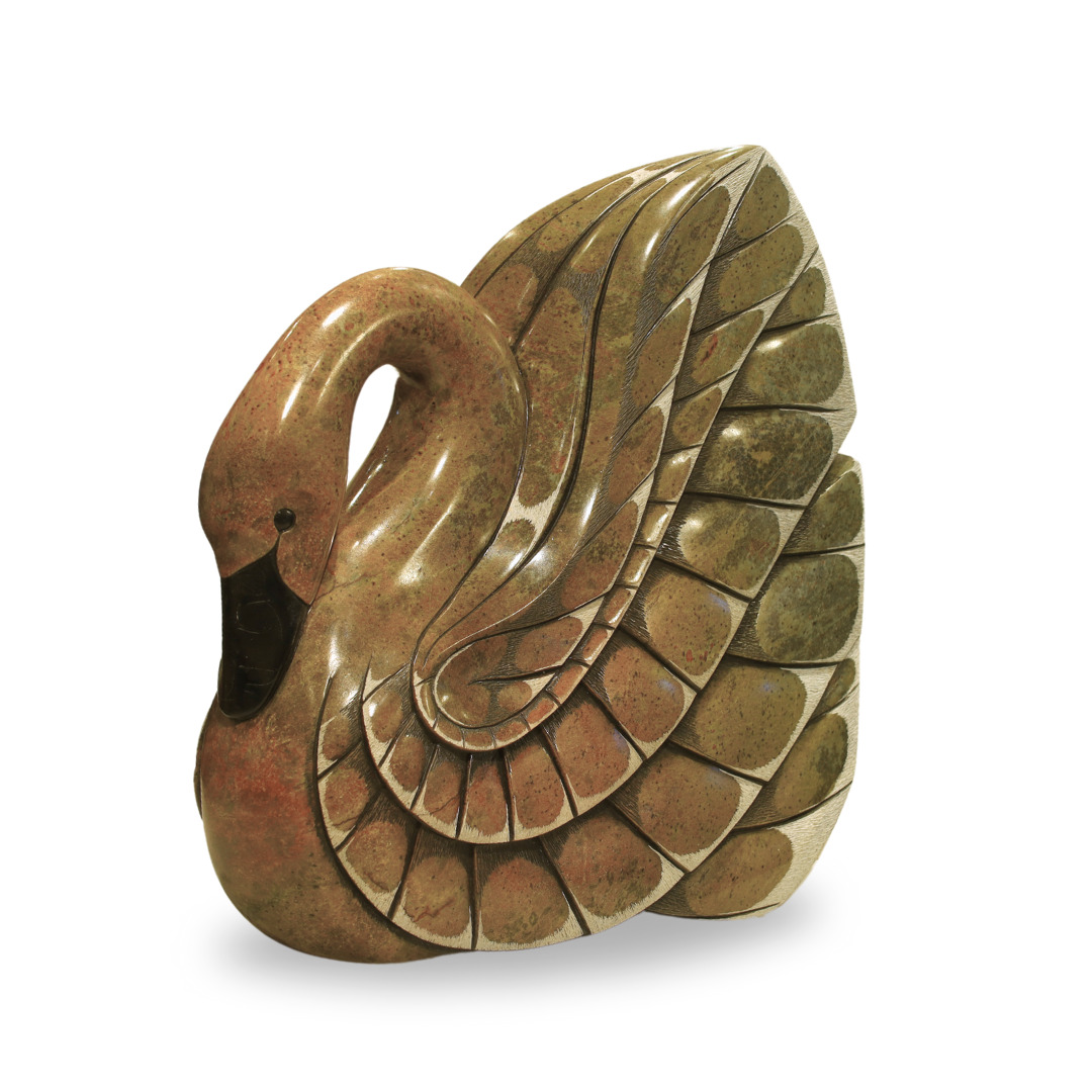 One original hand-carved sculpture by Iroquois artist, Eric Silver. One swan carved out of soapstone (steatite).