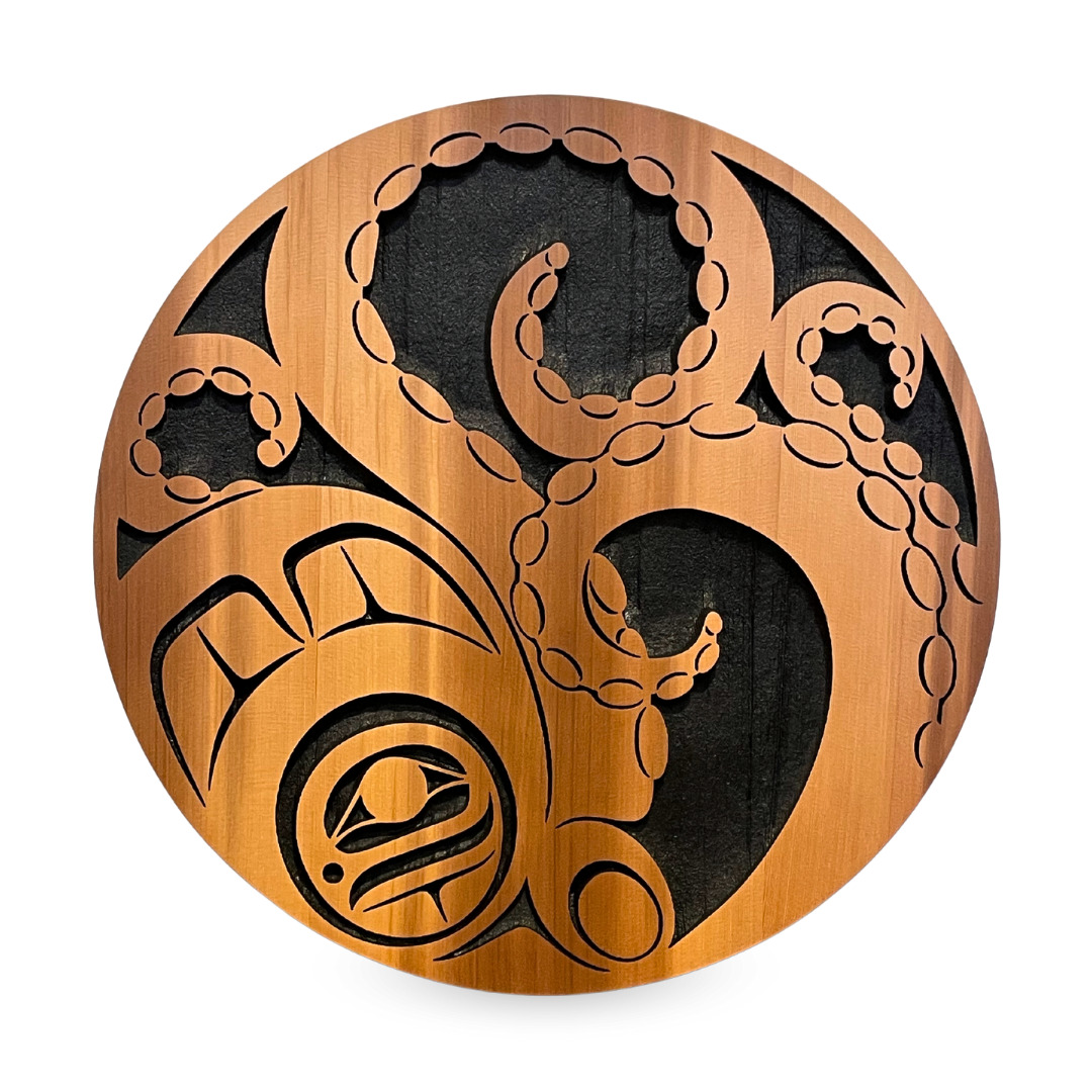 One original sand blasted carving by Nuxalk artist, Nusmata. One cedar wood panel depicting an octopus, painted black.