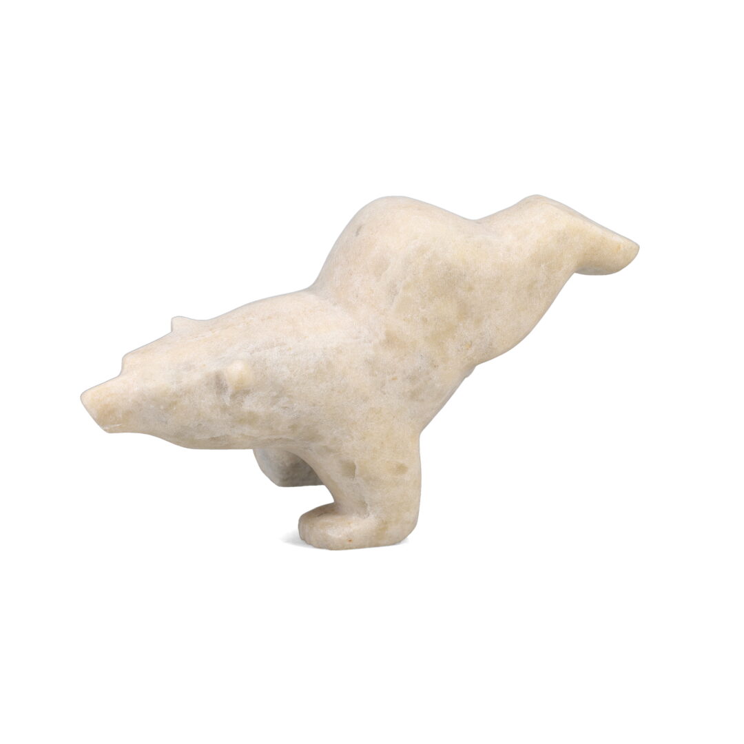 One original hand-carved sculpture by Inuit artist, Joanie Ragee. One 2-way diving bear carved out of marble.