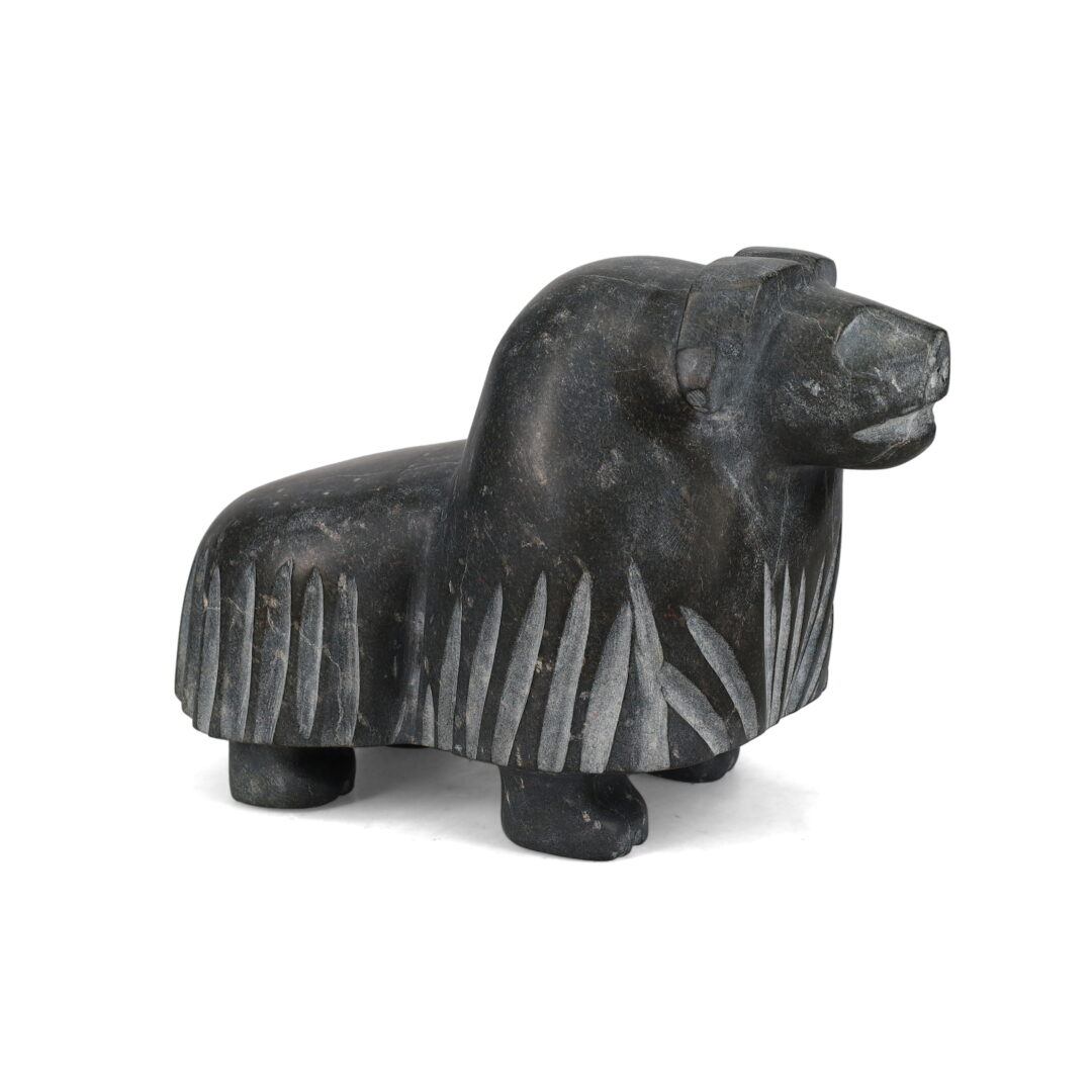 One original hand-carved sculpture by Inuit artist, Kupapik Ningeocheak. One musk-ox carved out of basalt.