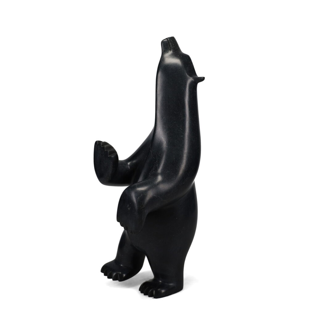 One original hand-carved sculpture by Inuit artist, Ashevak Adla. One dancing bear carved out of serpentine.