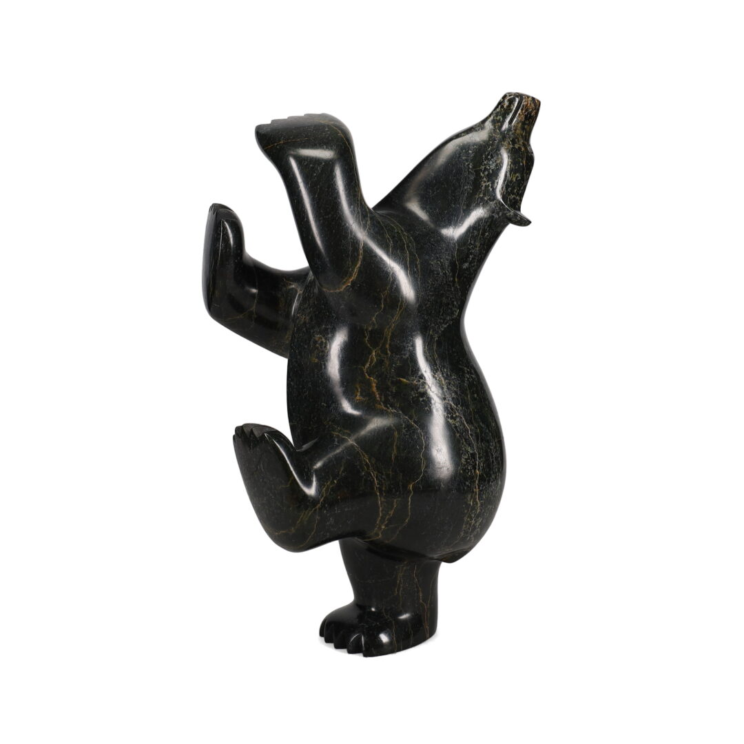 One original hand-carved sculpture by Inuit artist, Ashevak Adla. One dancing bear carved out of serpentine.