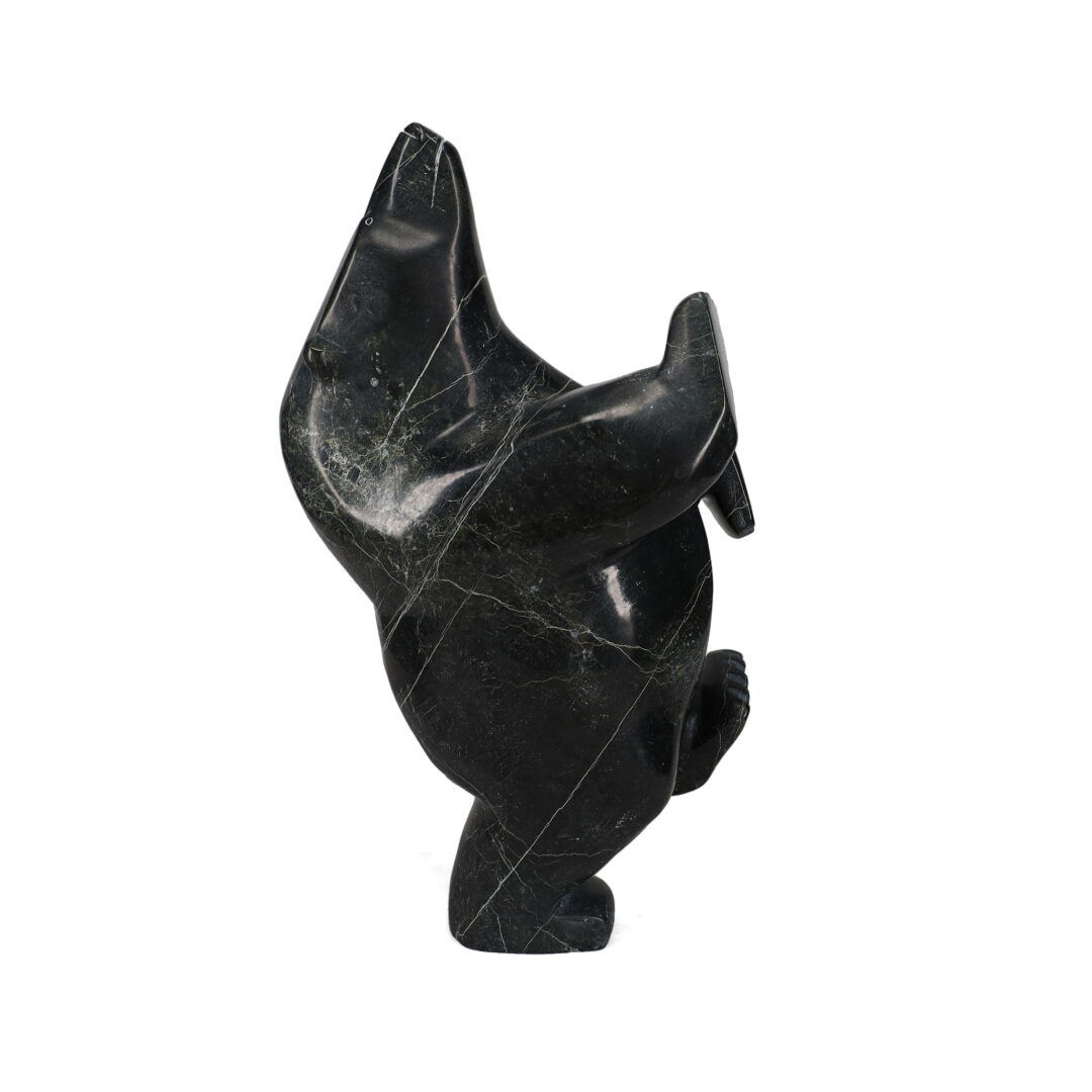 One original hand-carved sculpture by Inuit artist, Joanie Ragee. One dancing bear carved out of serpentine.