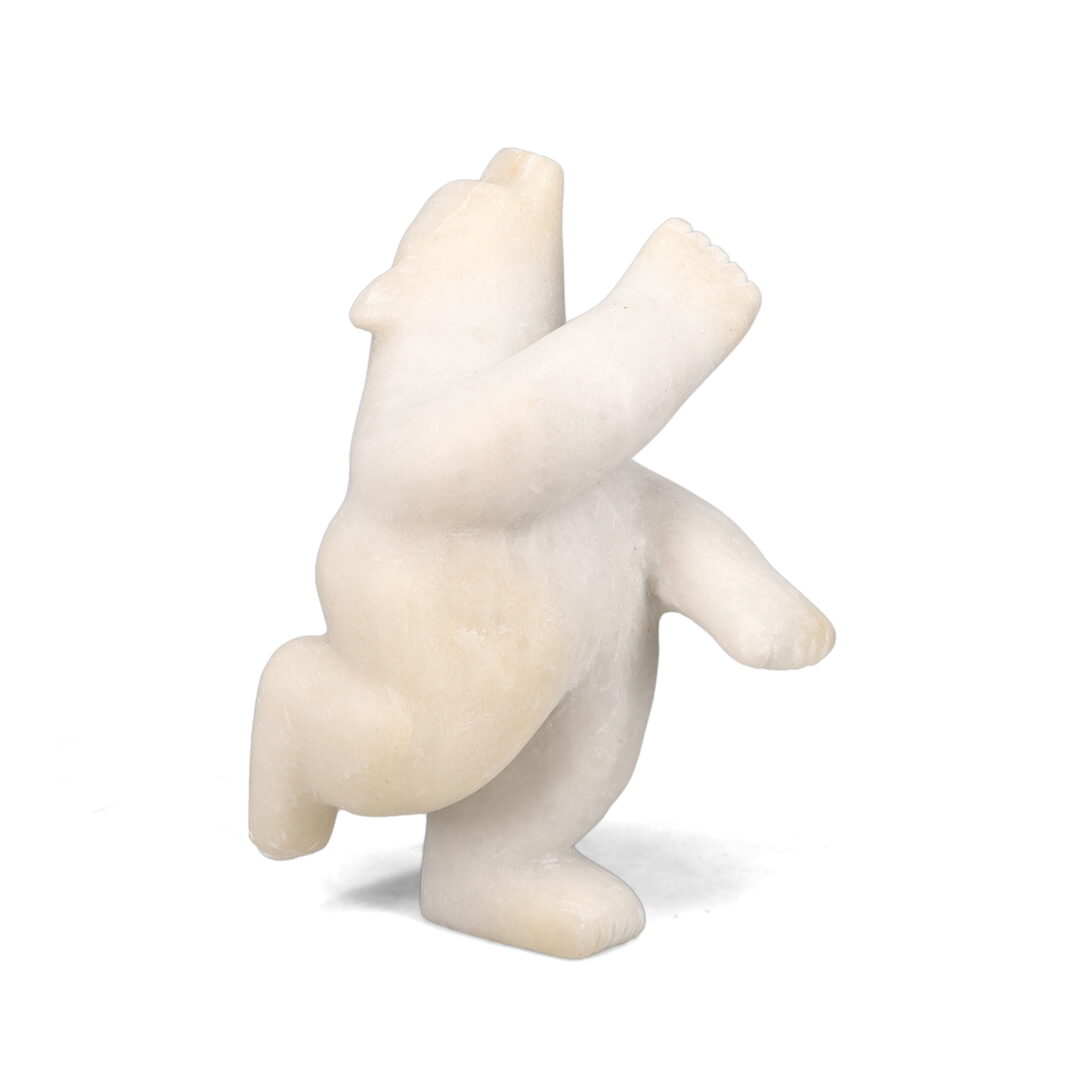 One original hand-carved sculpture by Inuit artist, Joanie Ragee. One 2-way diving bear carved out of marble.