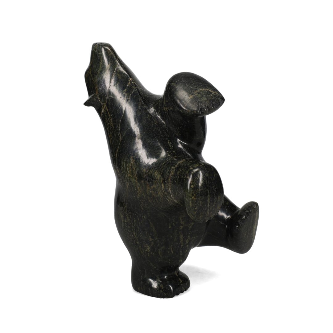 One original hand-carved sculpture by Inuit artist, Etidloie Adla. One dancing bear carved out of serpentine.