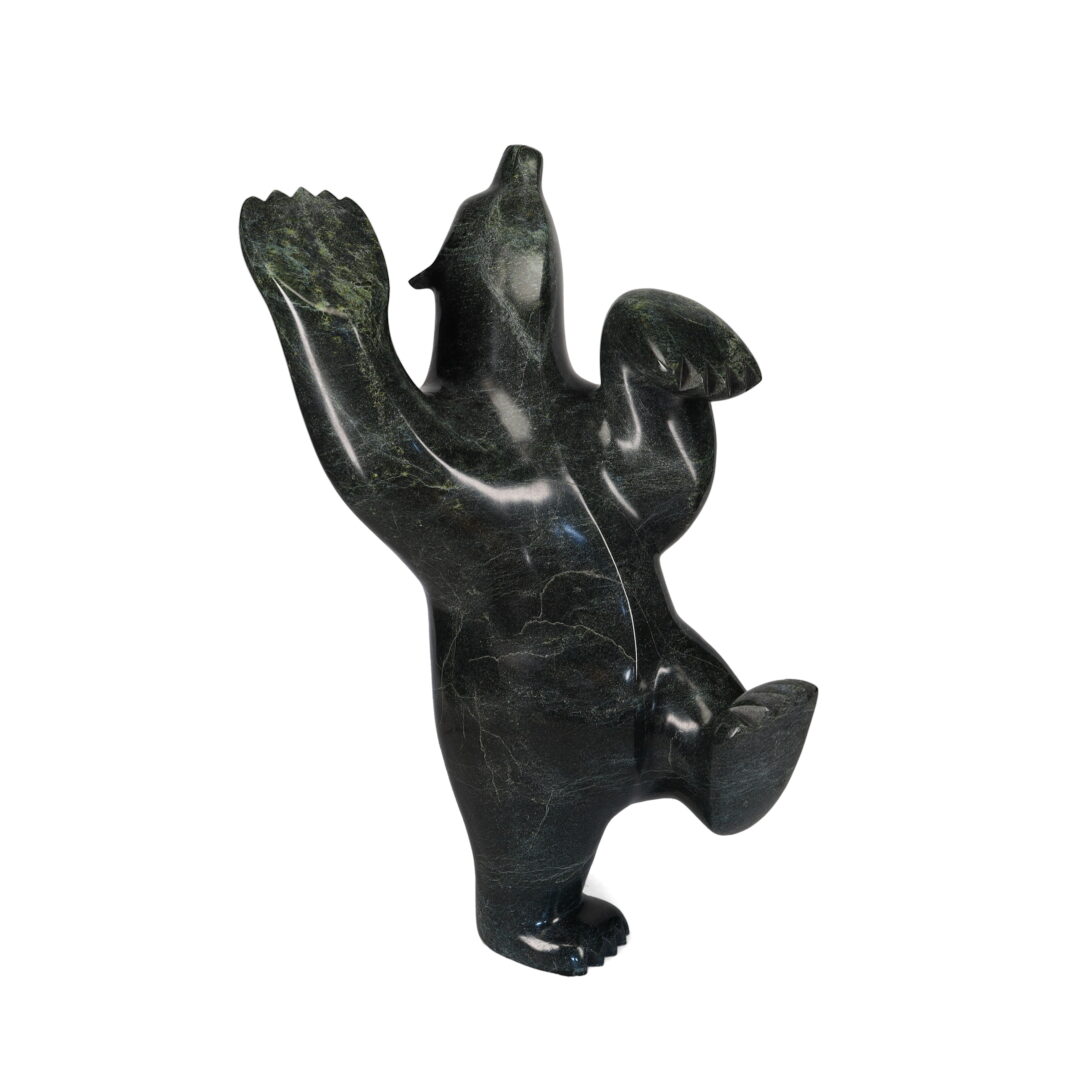 One original hand-carved sculpture by the Inuit artist, Ashevak Adla. One dancing bear carved out of serpentine stone.