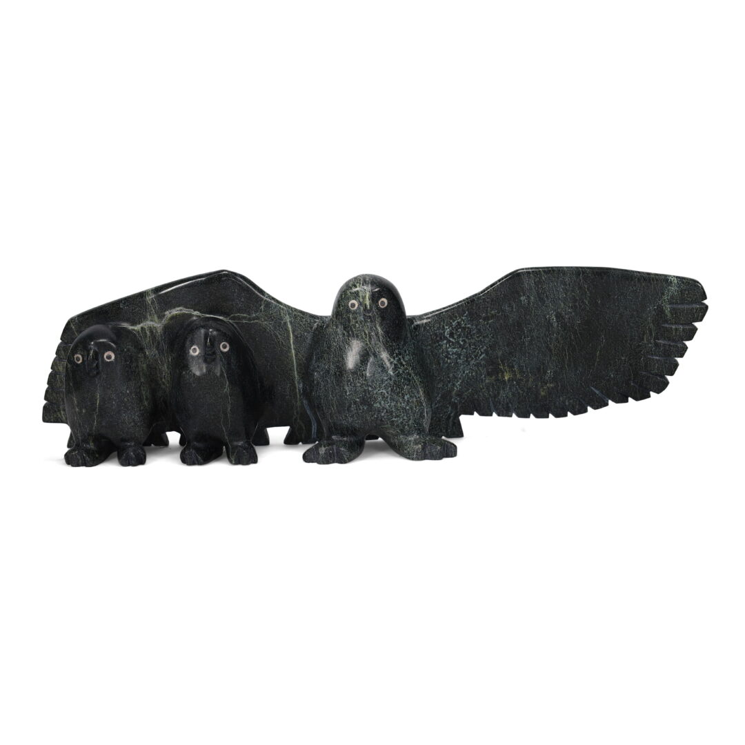 One original hand-carved sculpture by Inuit artist, Matthew Flaherty. One owl family carved out of serpentine.