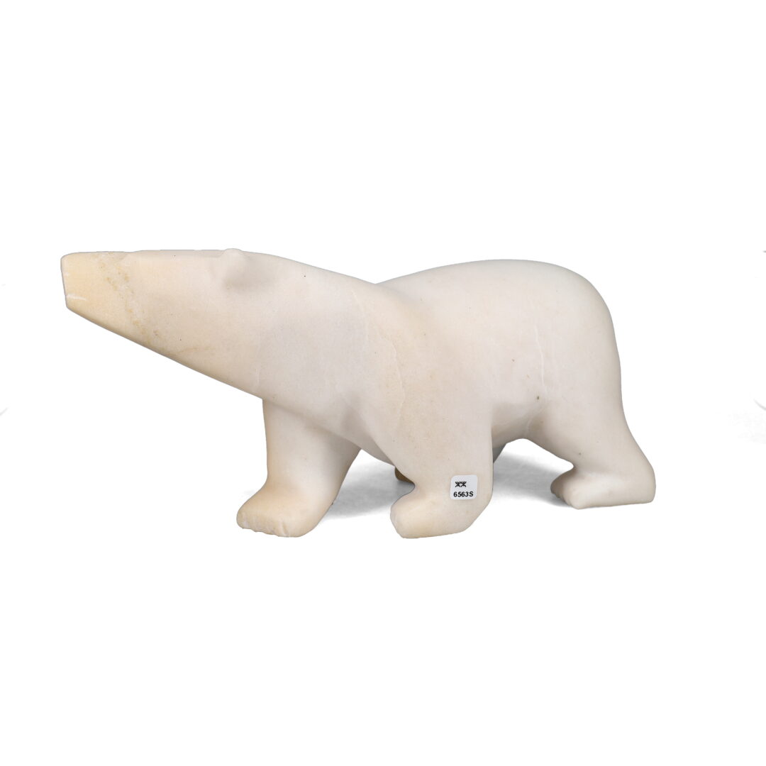 One original hand-carved sculpture by Inuit artist, Joanie Ragee. One 2-way diving bear carved out of marble.