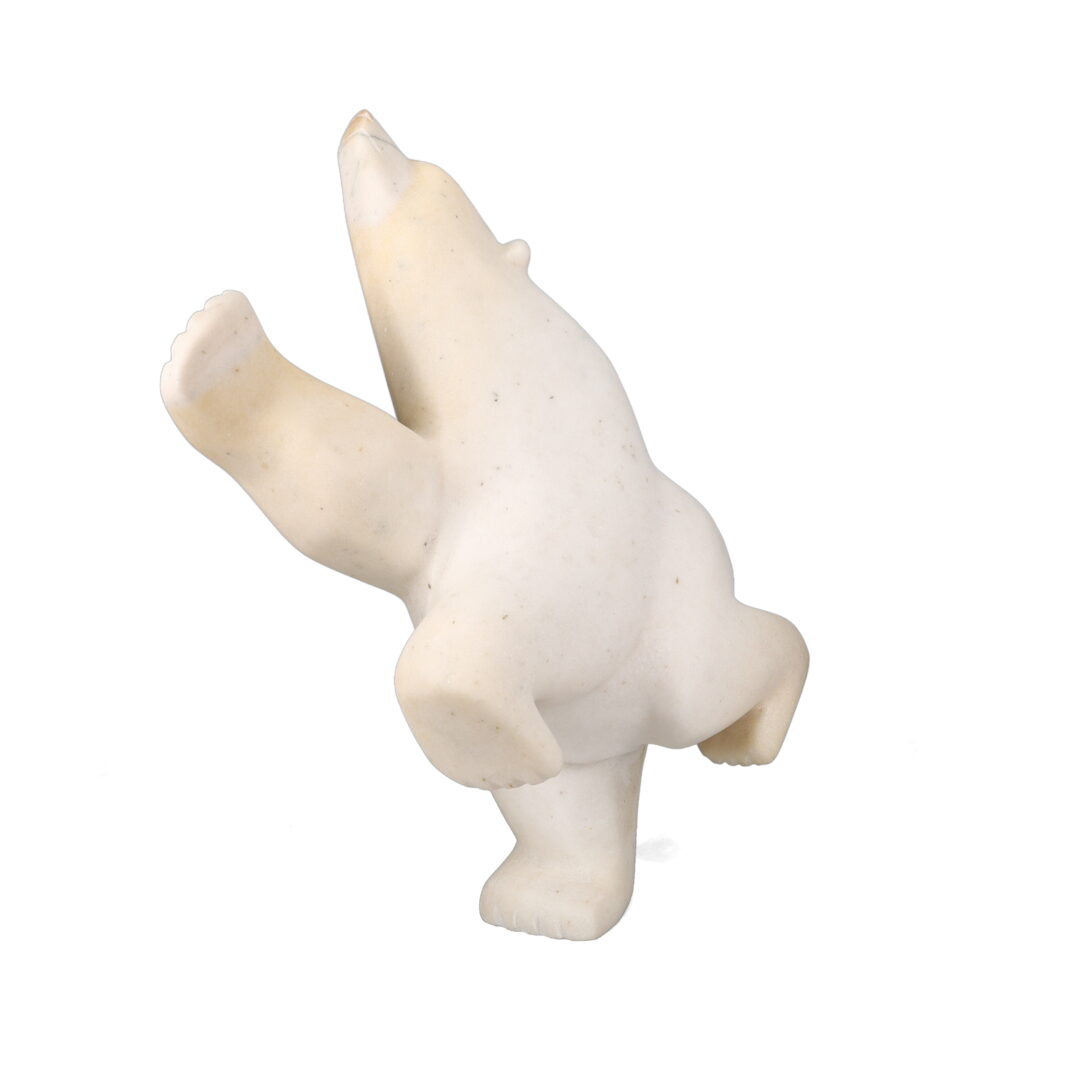 One original hand-carved sculpture by Inuit artist, Joanie Ragee. One dancing bear carved out of white marble.