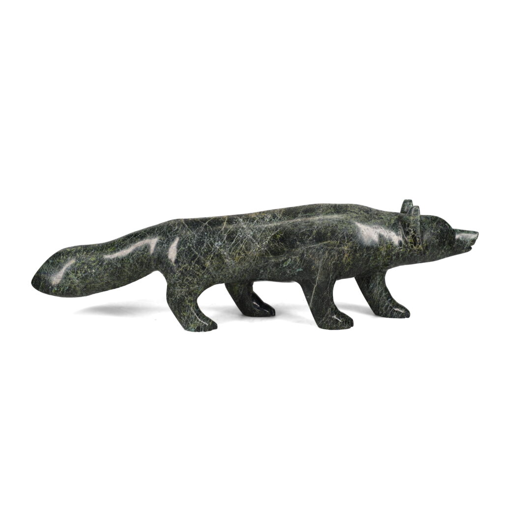 One original hand-carved sculpture by Inuit artist, Matthew Flaherty. One wolf carved out of serpentine stone.