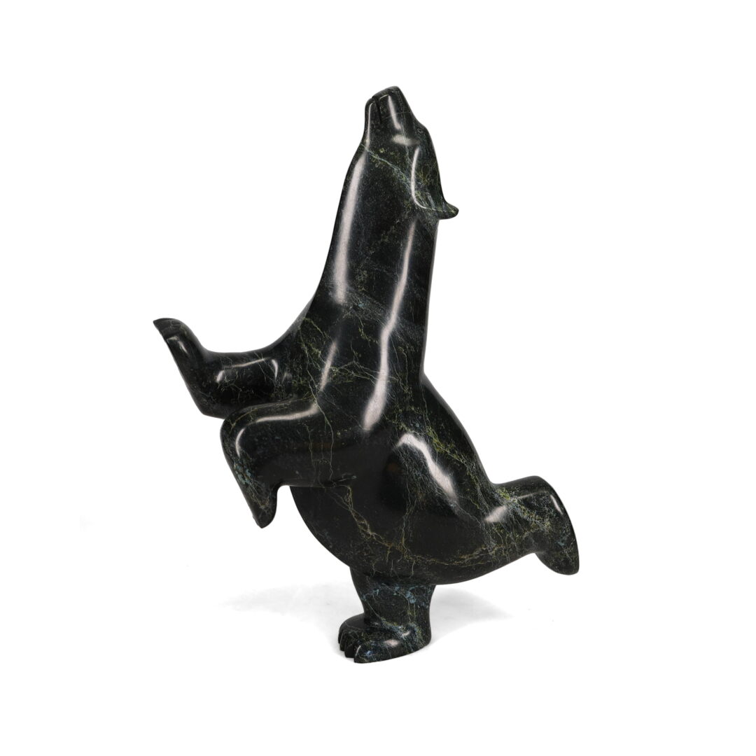 One original hand-carved sculpture by Inuit artist, Ashevak Adla. One dancing bear carved out of serpentine.