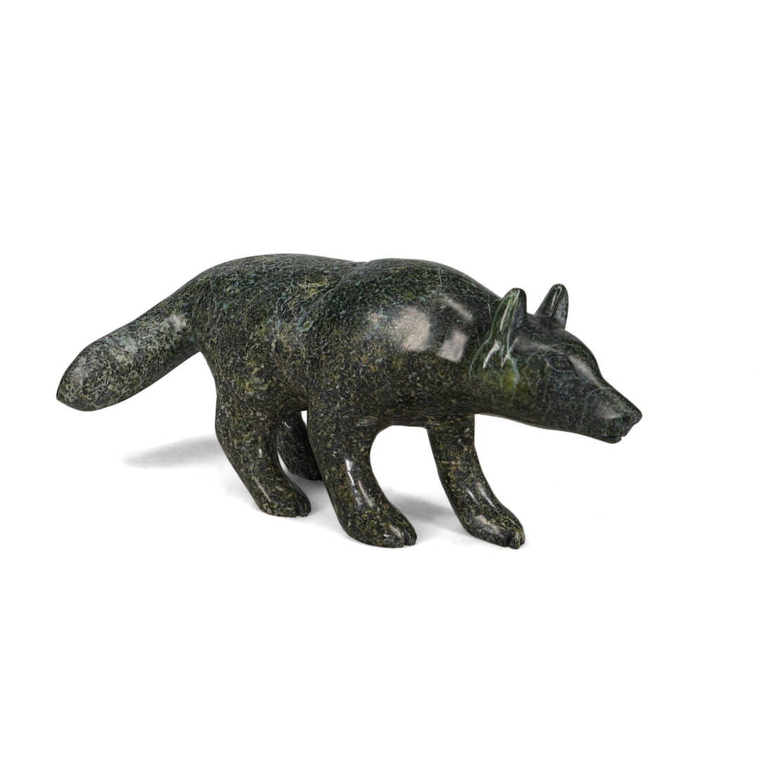 One original hand-carved sculpture by Inuit artist, Matthew Flaherty. One wolf carved out of serpentine stone.